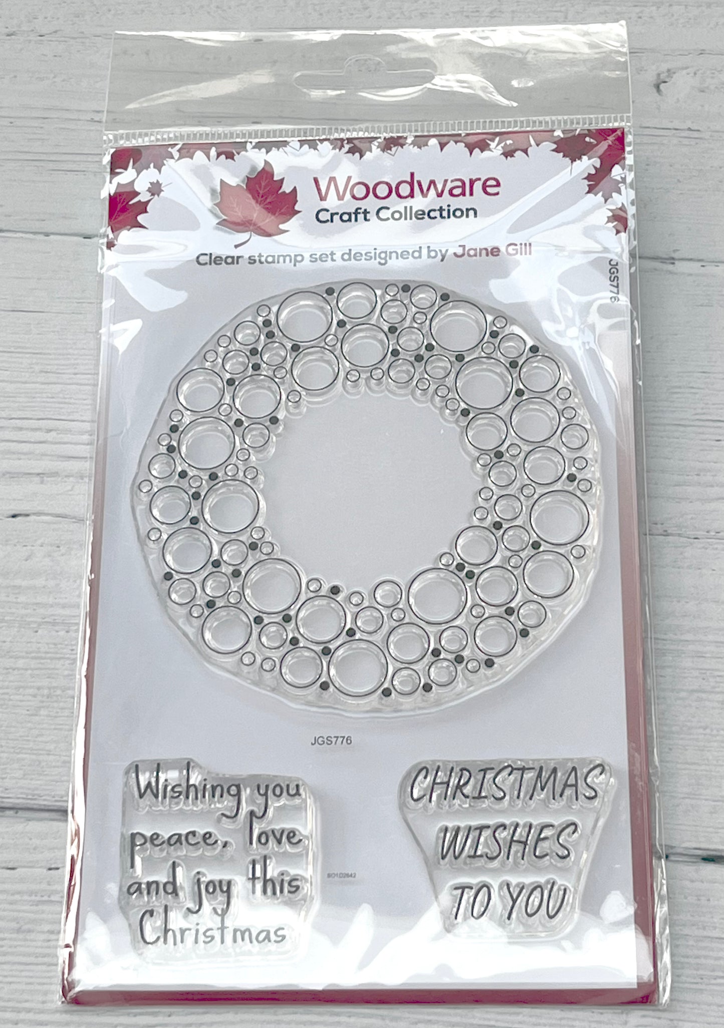 Woodware Craft Collection clear stamp set with bubble design and Christmas messages on a white background.